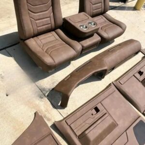 Revamp your ’85 C10 with this rich, brown custom interior! Features hand-stitched top-grain leather buddy bucket seats, matching door panels, dash trim, and an optional retro-modern center console. Built for comfort, style, and rugged charm.